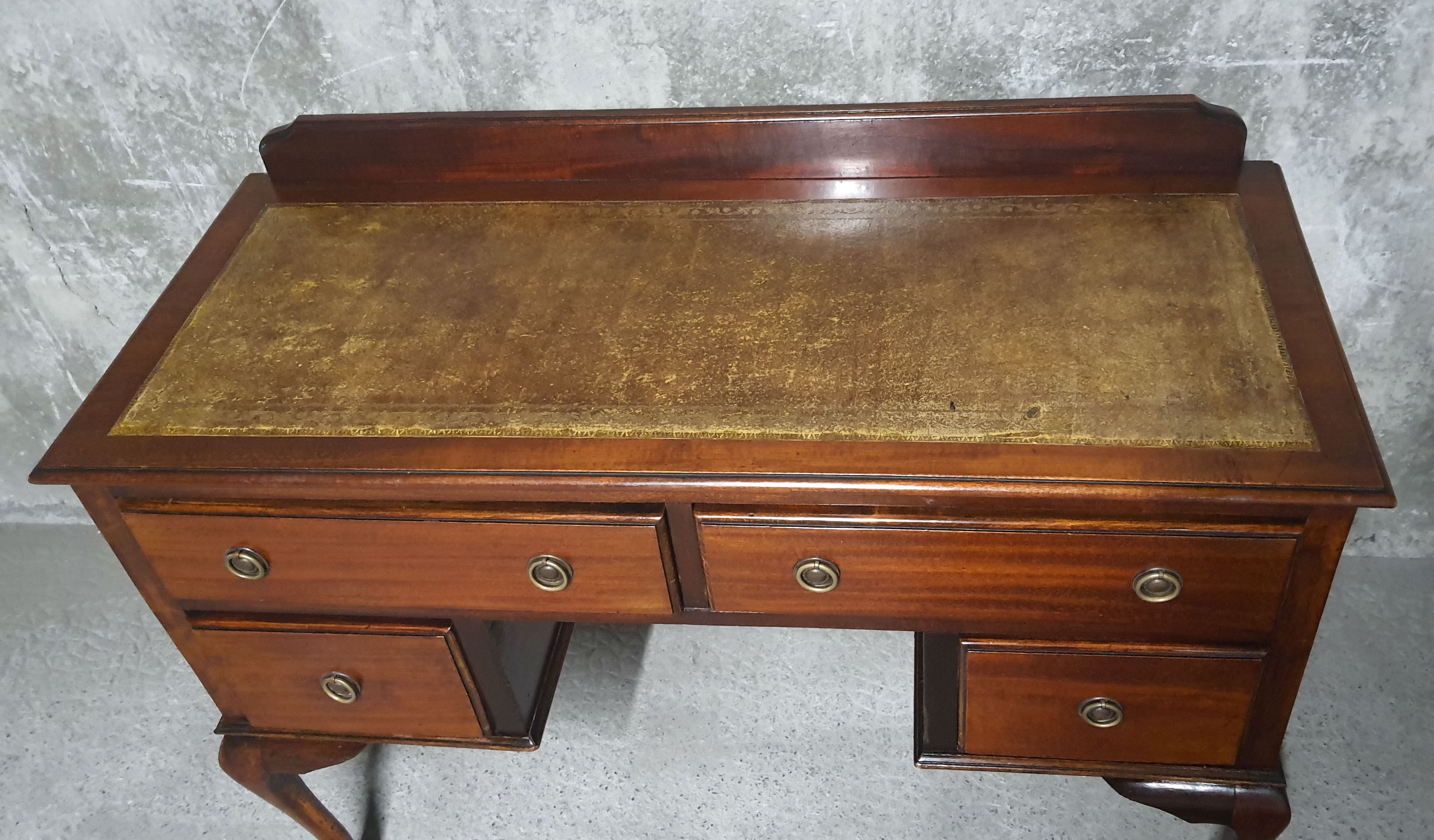 Old desk in cherry and green leather