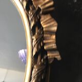 Oval golden mirror