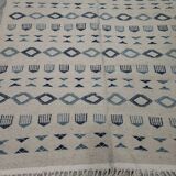 Handmade white and blue rug made of natural wool