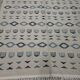 Handmade white and blue rug made of natural wool
