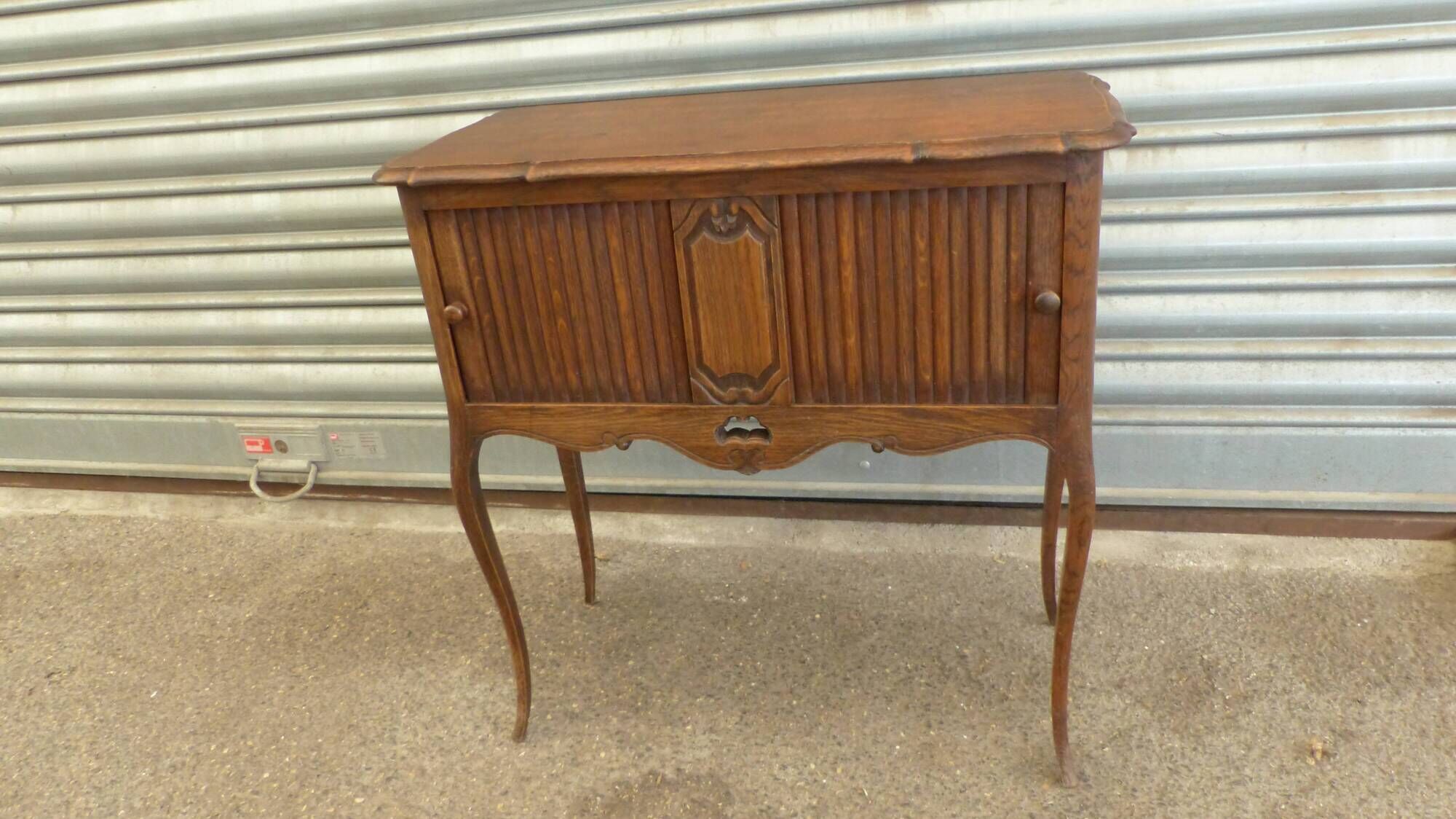 Piece of furniture with two Louis XV-style curtains.