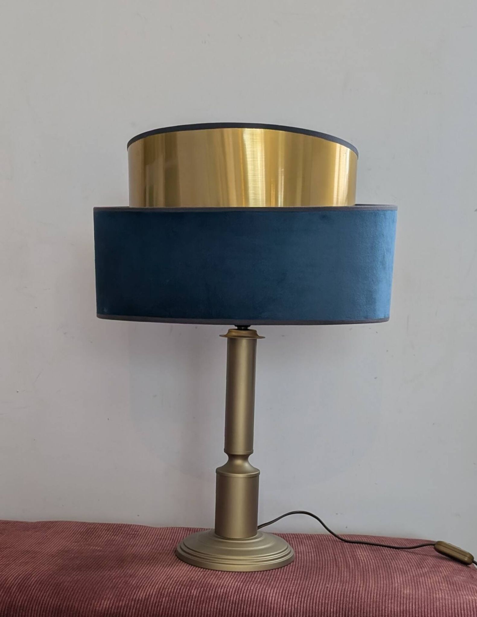 Brass lamp with asymmetrical velvet shade