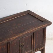 Chinese low altar cabinet with two doors and dark patina – China, around 1900