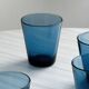 Four small translucent blue glasses.