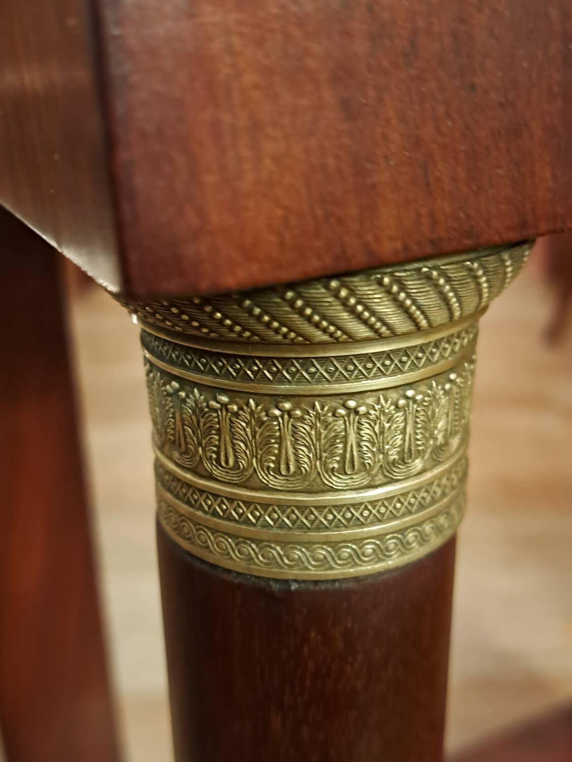 Empire style bedside table in mahogany and bronze