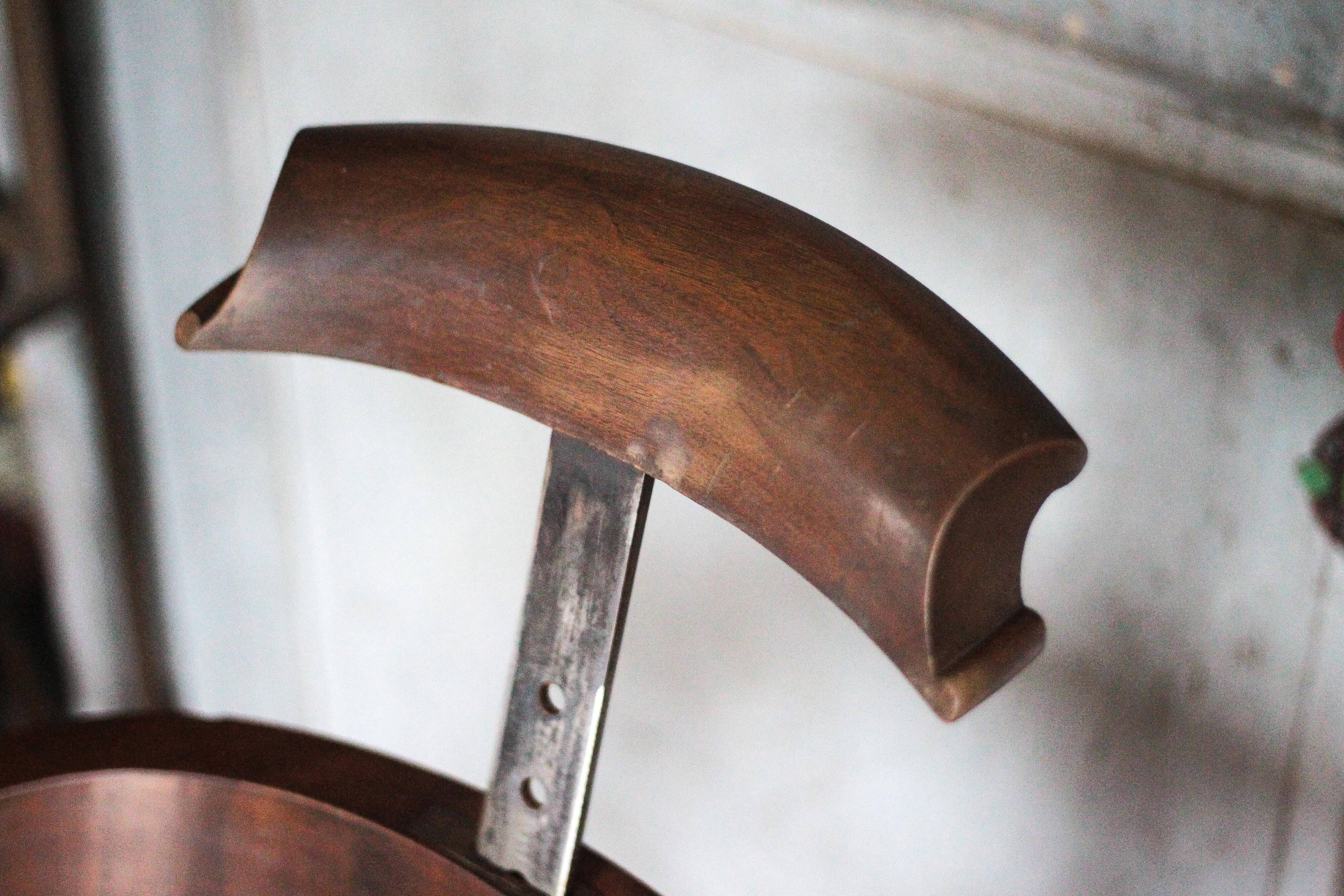 Barber chair in wood and leather with adjustable headrest, office chair.