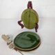 Small plate in glazed green earthenware