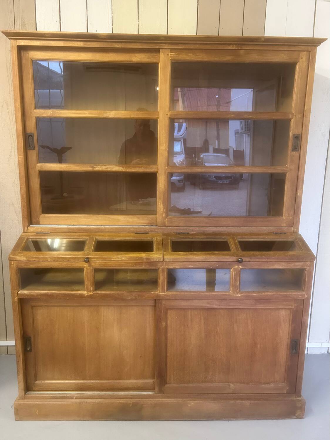Large antique haberdashery cabinet with glass doors.