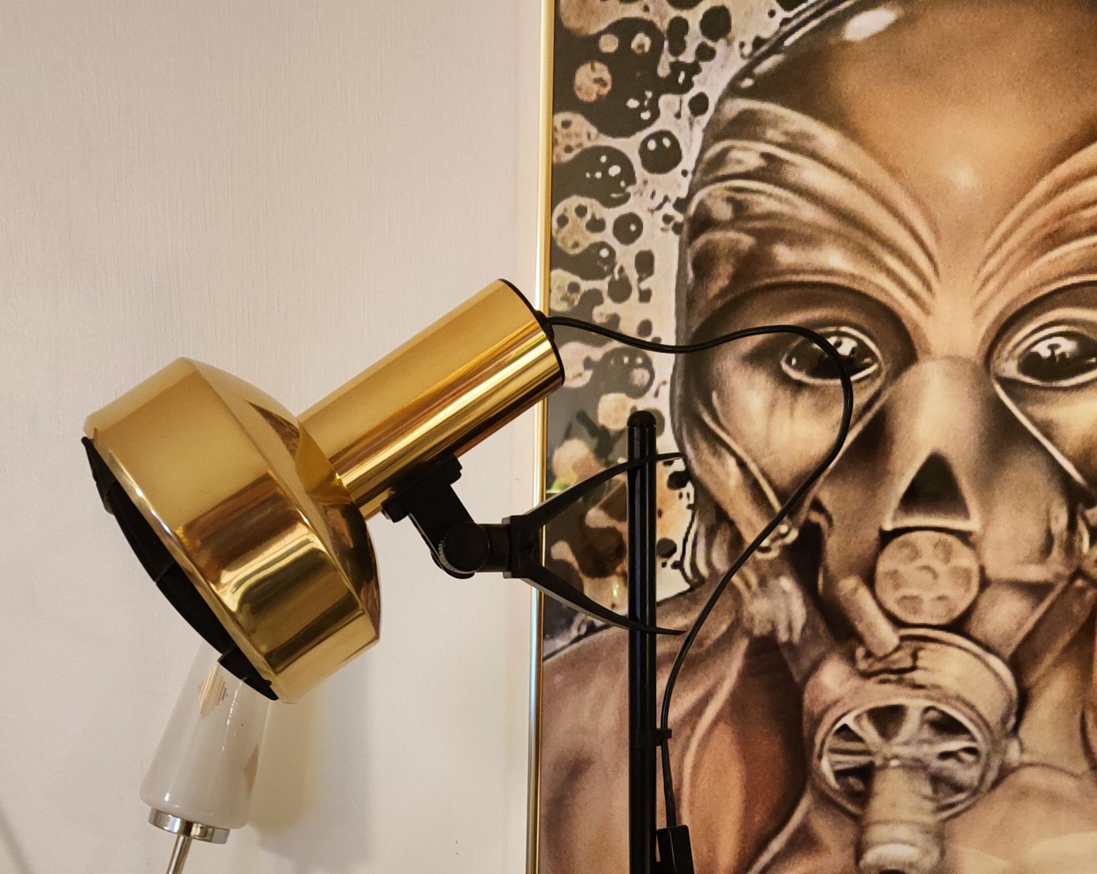 Black floor lamp is gold vintage 1980