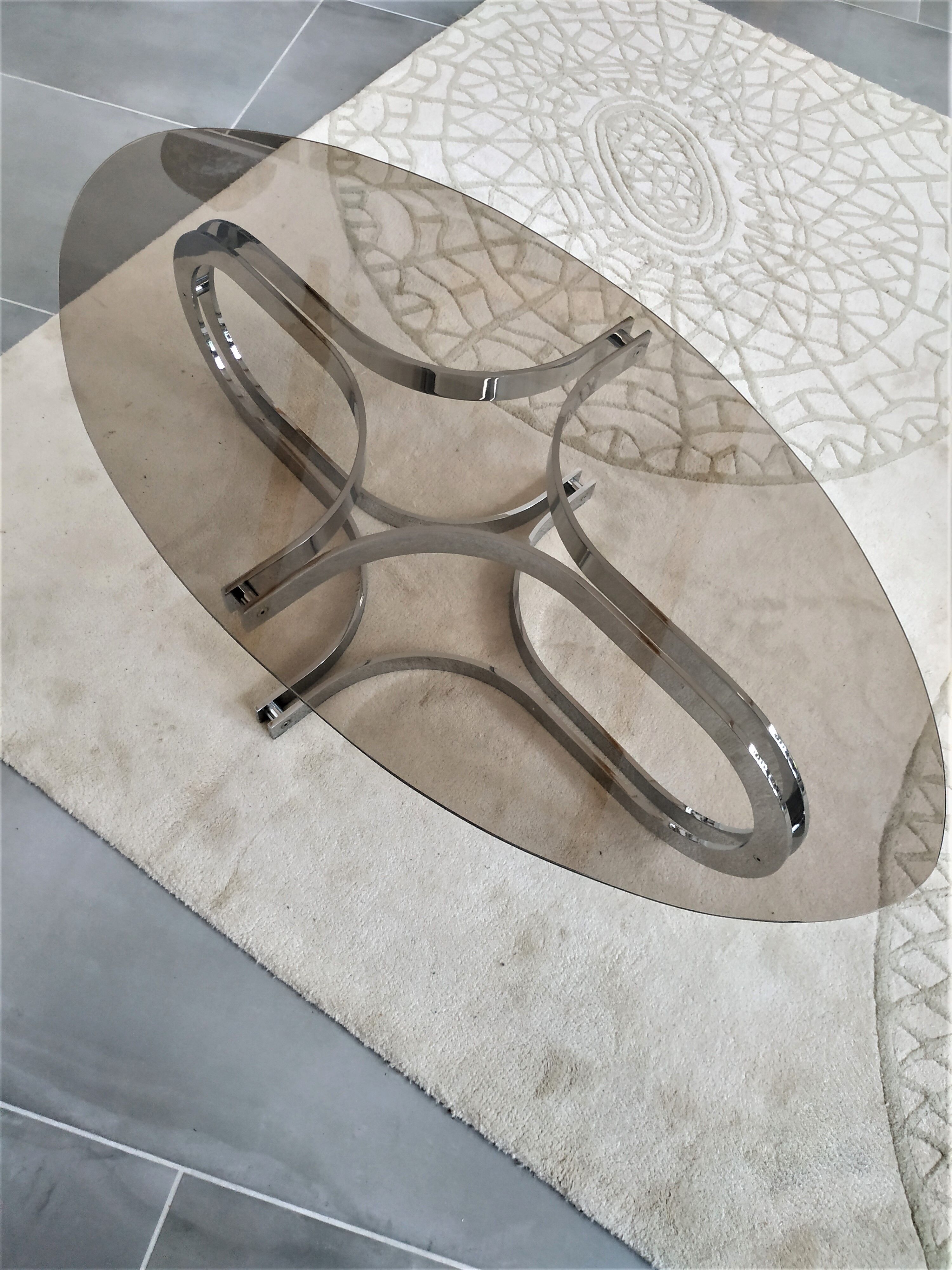 Chrome metal coffee table and oval smoked glass tray