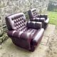 Pair of upholstered armchairs in aubergine imitation leather