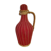 Glass bottle and rattan and scoubidou braiding 1960