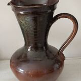Large ceramic pitcher in brown monochrome.