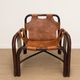 Pair of Tito Agnoli armchairs in leather and bamboo, 1970s.