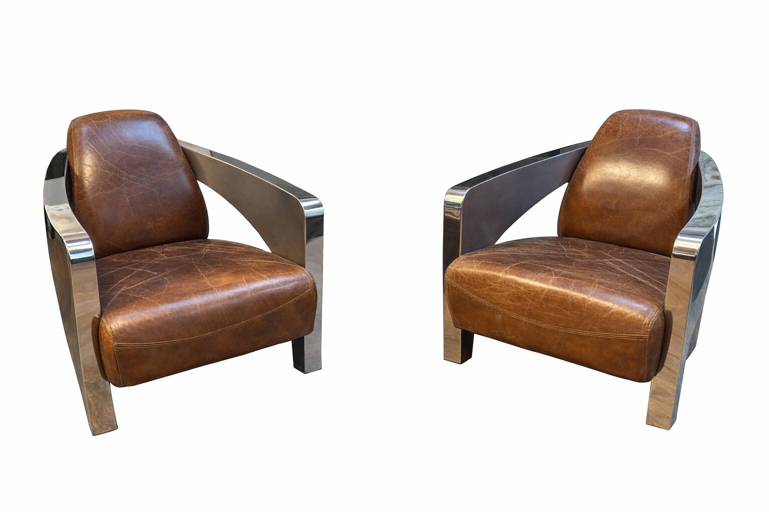 Set of 3 Stacyville items, leather and stainless steel, 2 armchairs and a sofa.