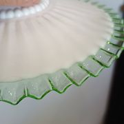Portable lamp with green and white glass suspension
