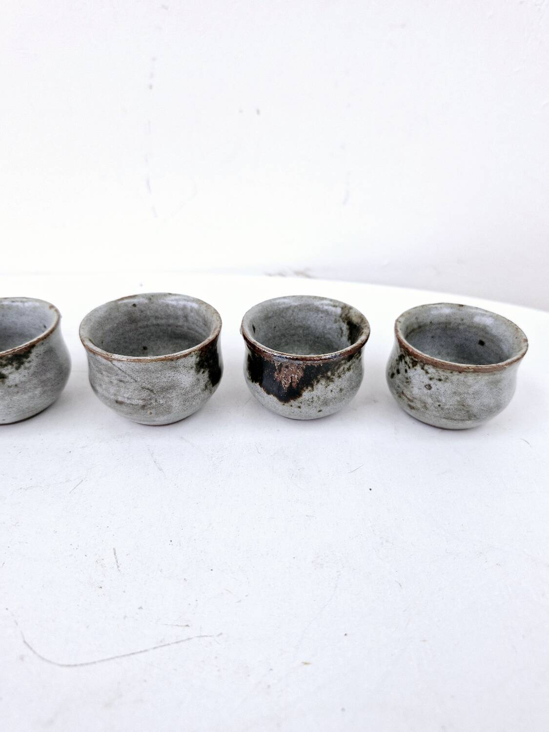 Vintage enameled stoneware service with 6 small bowls and a sugar bowl or sauce bowl