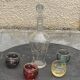 Liqueur carafe, or aperitif, carved with floral decoration in transparent glass and 4 polka dot glasses