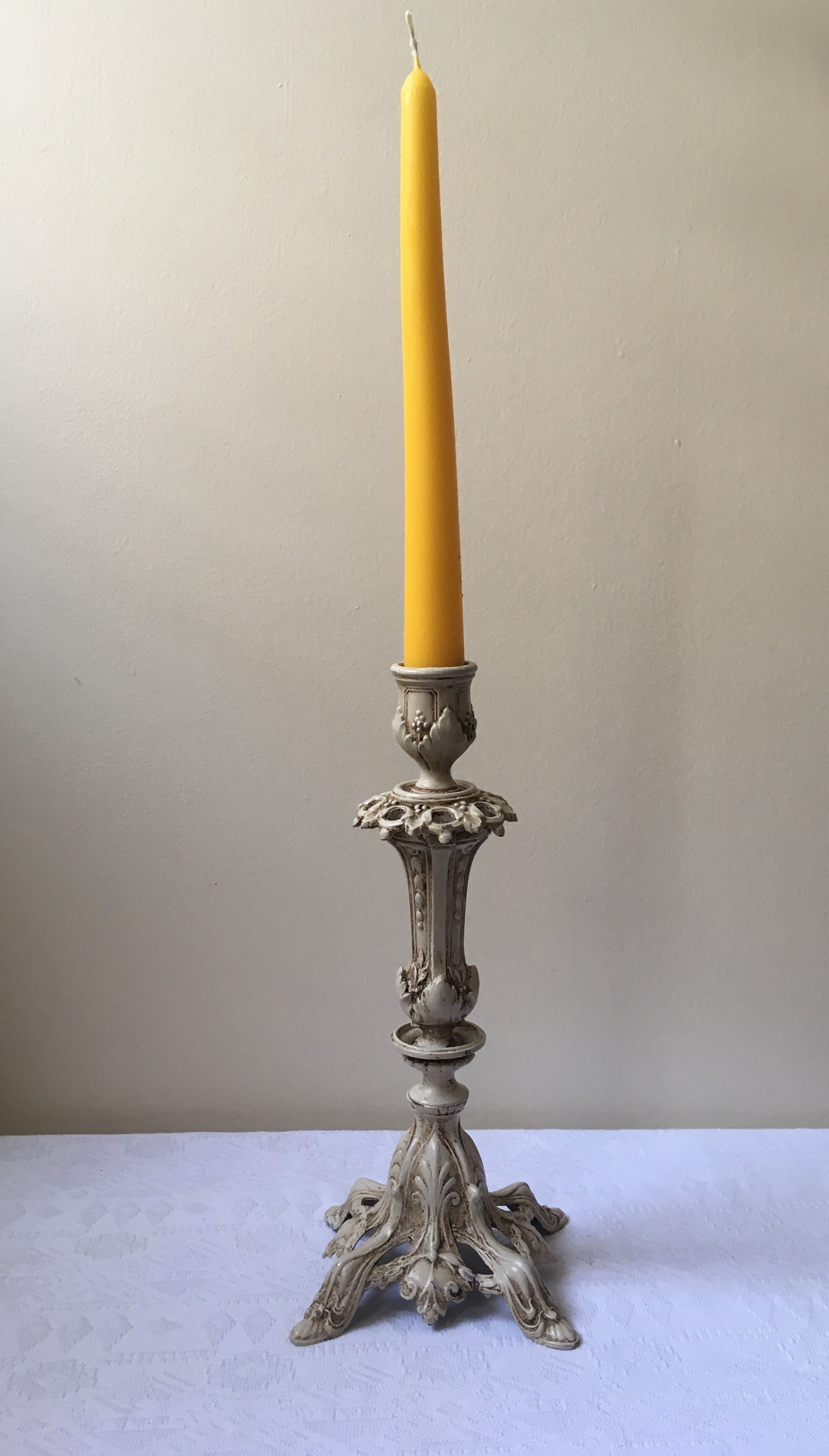 Large candle holder in patinated white painted metal