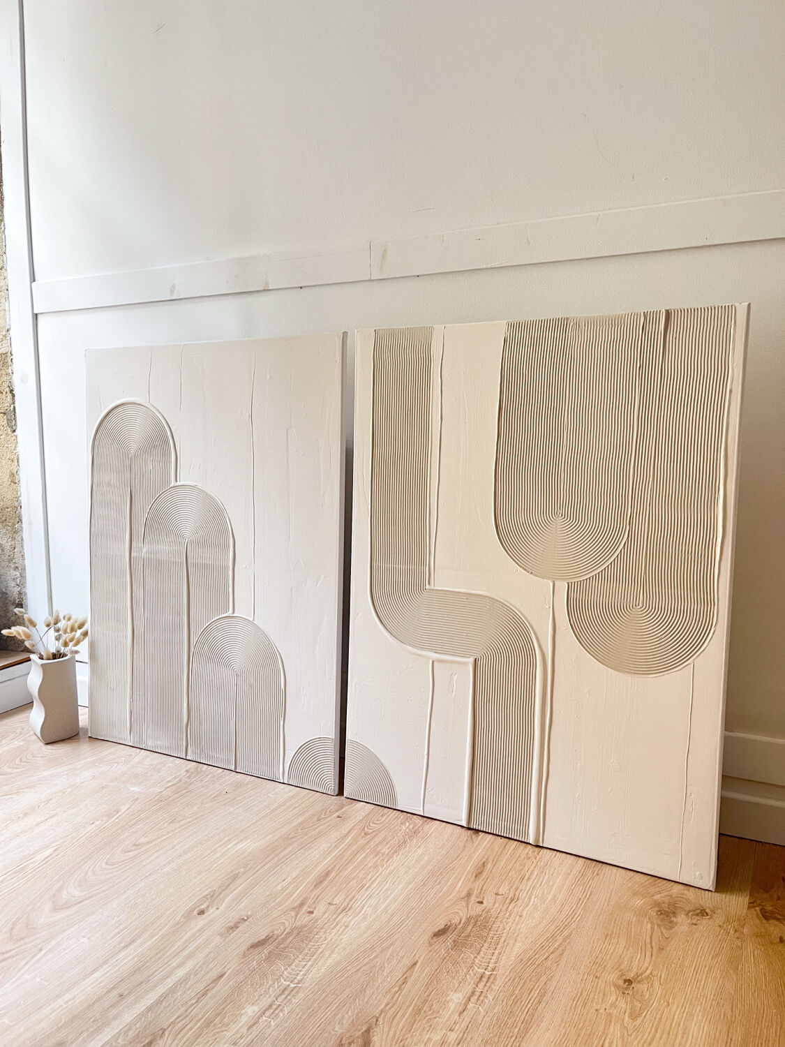 Beige and white relief diptych panels