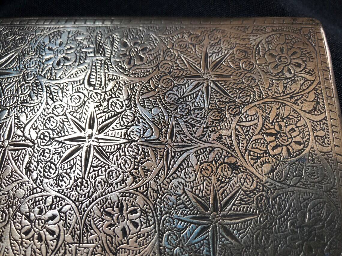 Chiseled bronze cigarette case from the late 19th century