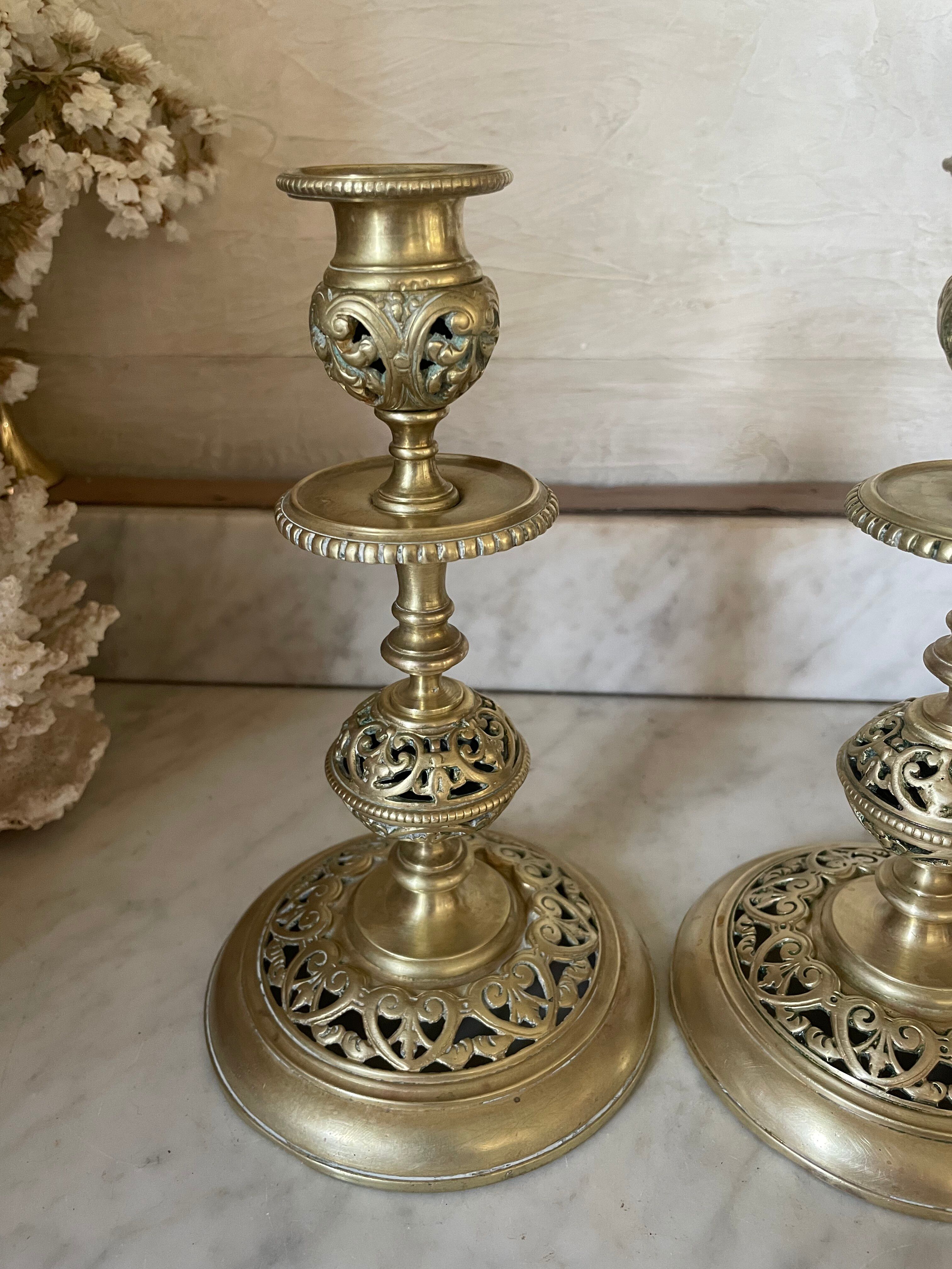 pair of openwork gilded brass candlesticks from the 19th century