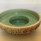 Green ceramic candle holder with a frieze