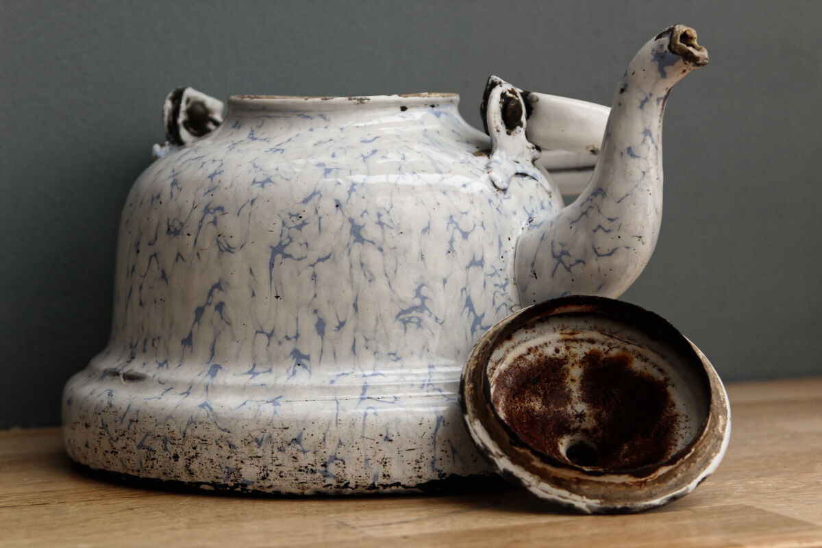 Old enamelled sheet metal kettle