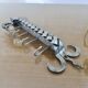 2 Tea towel holders, ironwork in braided raw steel, 1970