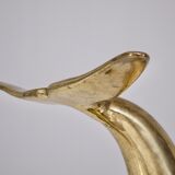Solid brass dolphin console feet.