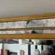Large gold mirror by Deknudt with parcloses from the 1970s.