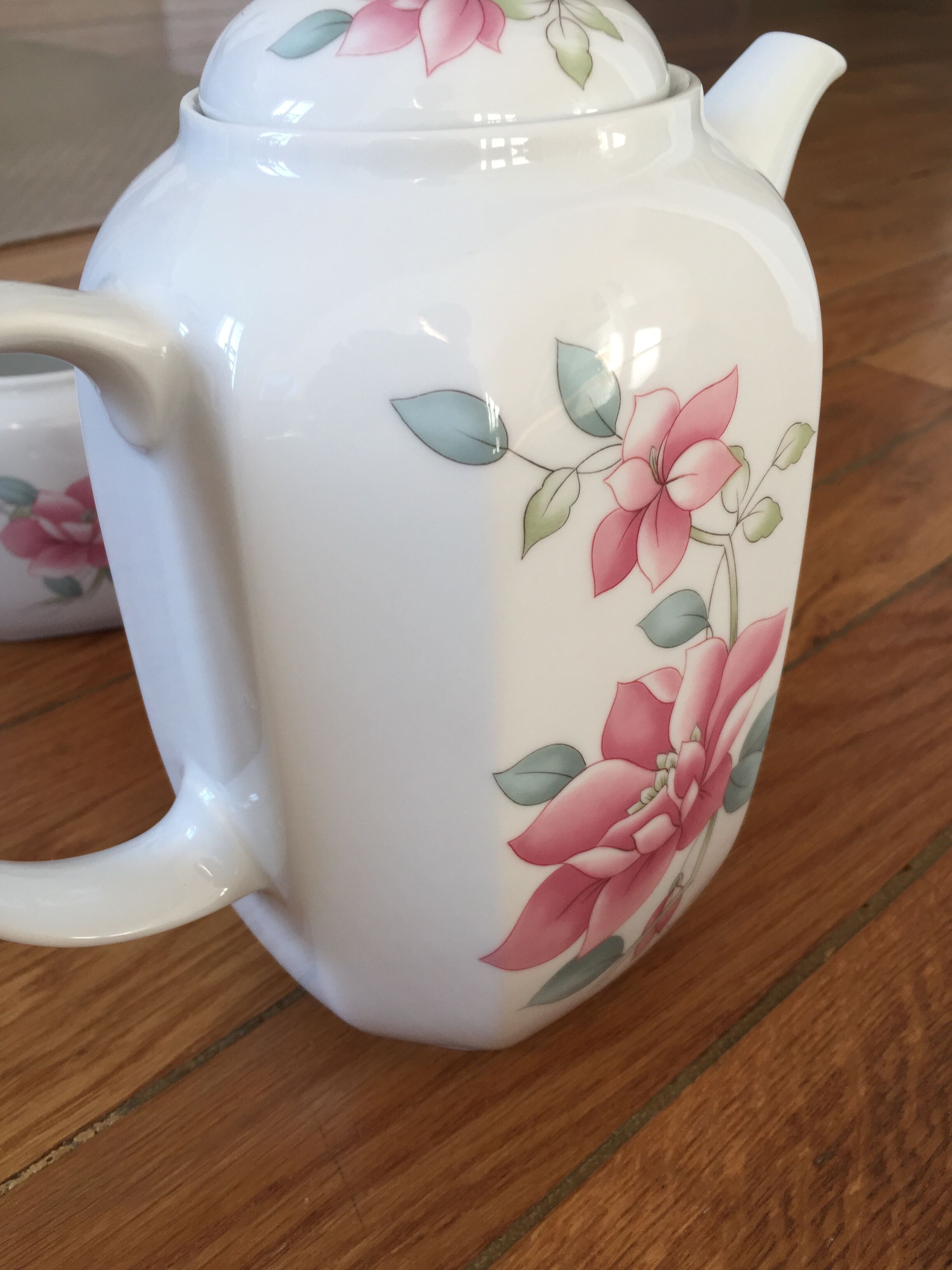 Vintage porcelain coffee or teapot with milk jug