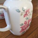 Vintage porcelain coffee or teapot with milk jug