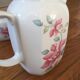 Vintage porcelain coffee or teapot with milk jug