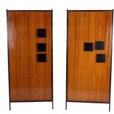 Pair of mahogany veneer and black lacquered iron cabinets. 1950s.