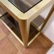 Regency style console table, in gilded metal and smoked glass