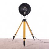Old industrial spot on wooden tripod