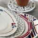 4 assiettes plates 1950