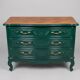 Restored cherry wood chest of drawers in English green.