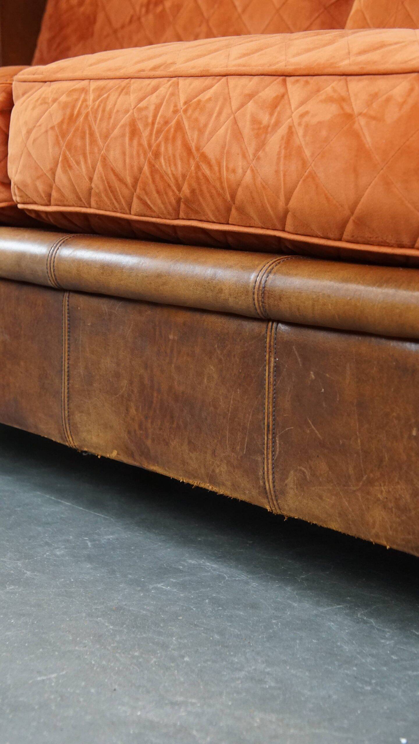 Luxury and comfortable sheepskin 2.5-seater sofa of top quality with orange fabric seat and back cushions