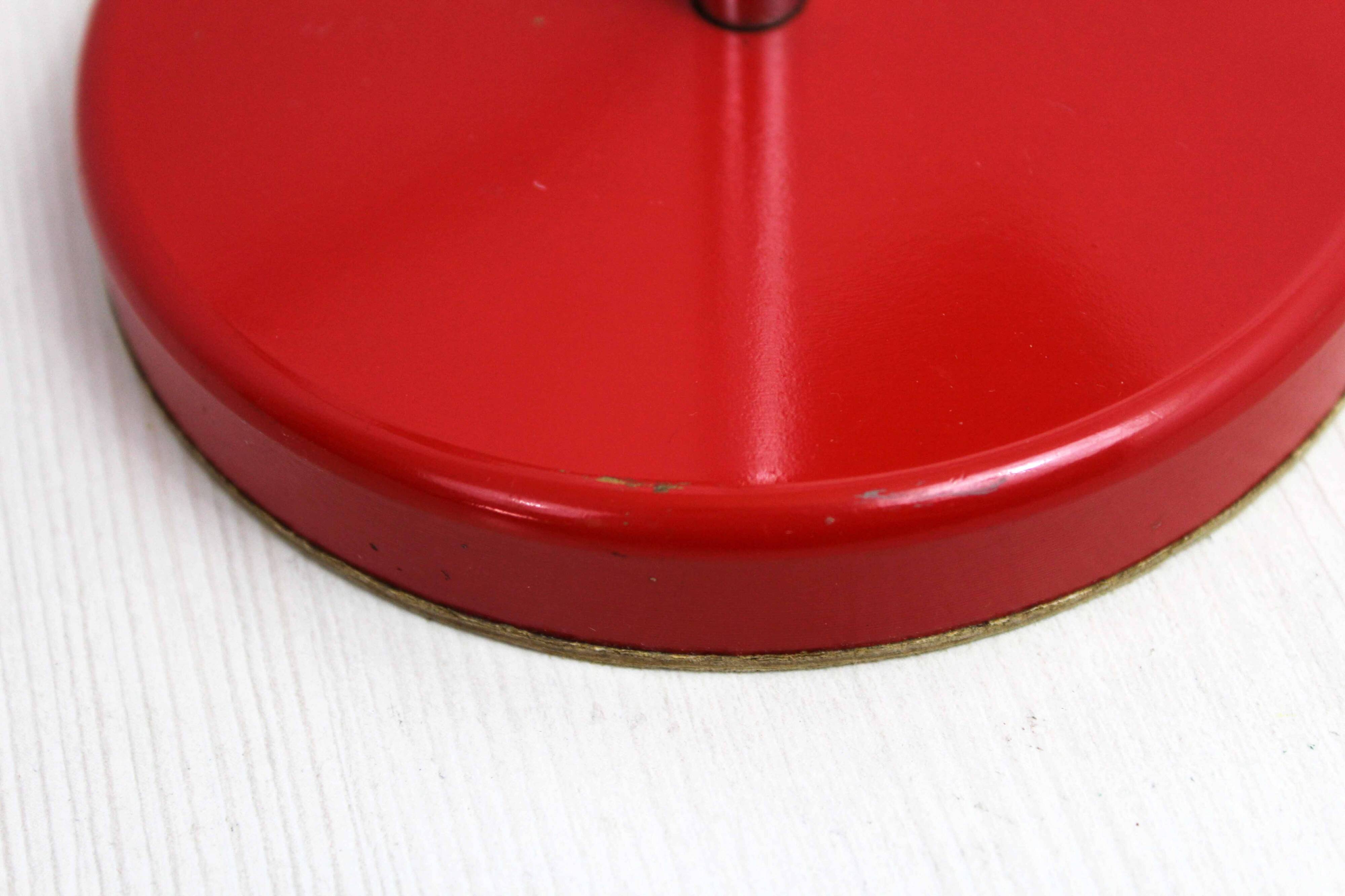 Red metal articulated desk lamp