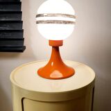 Orange metal and glass table lamp, circa 1960.