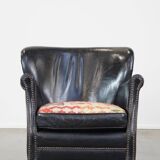 Subtle black armchair with reversible Kelim seat cushion