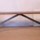 Old bench in Burmese teak with a wrought iron base.