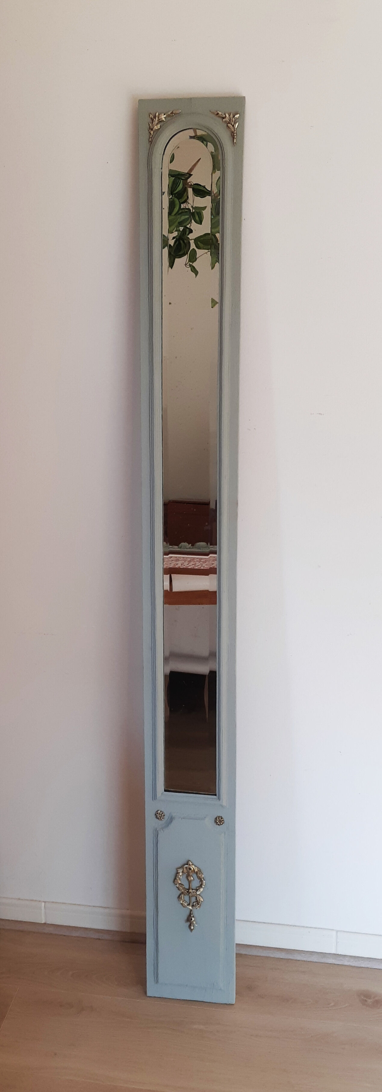 Old mirror patinated green of gray