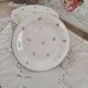 Lot de 12 assiettes à dessert en porcelaine de Limoges décor floral doré