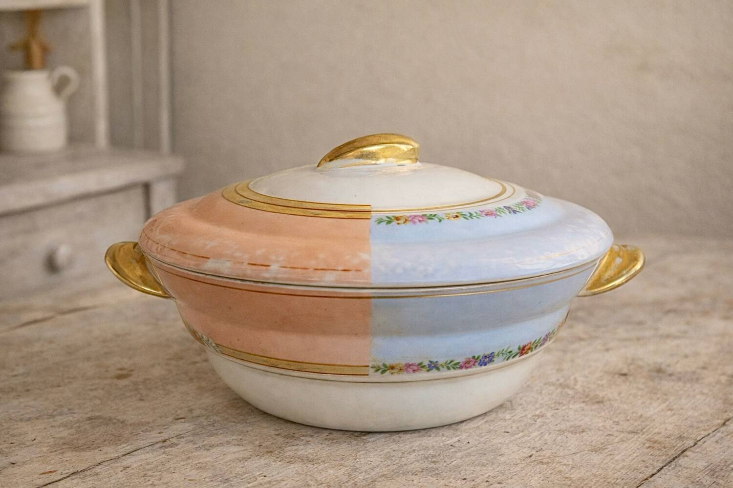 Antique Limoges porcelain soup tureen with two decorations.