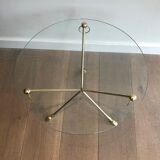 Round coffee table of neoclassical style in brass