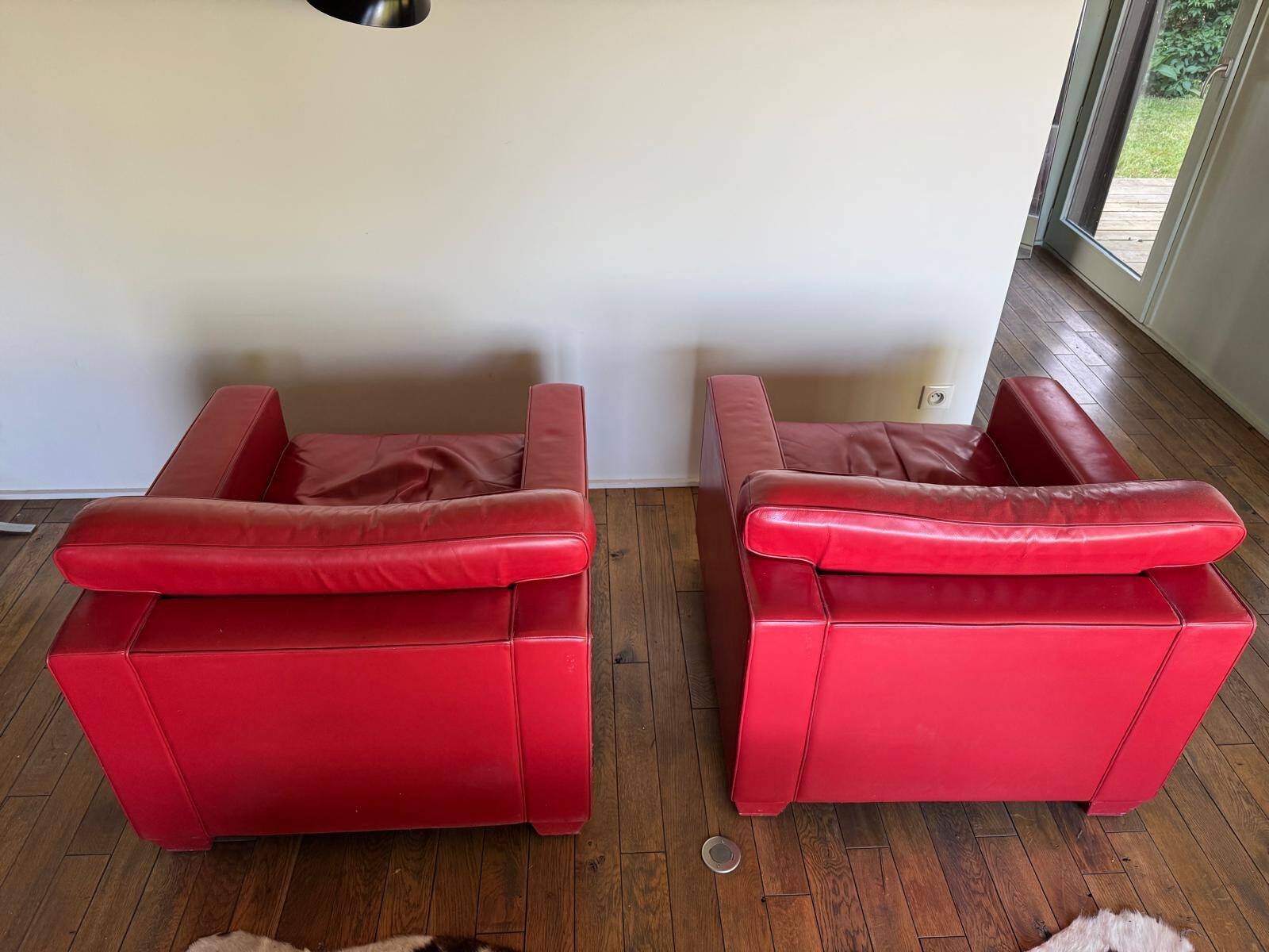 Paire de fauteuils en cuir réédition Jean Michel Franck