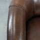 Set of two sheepskin club armchairs with fixed seat cushions